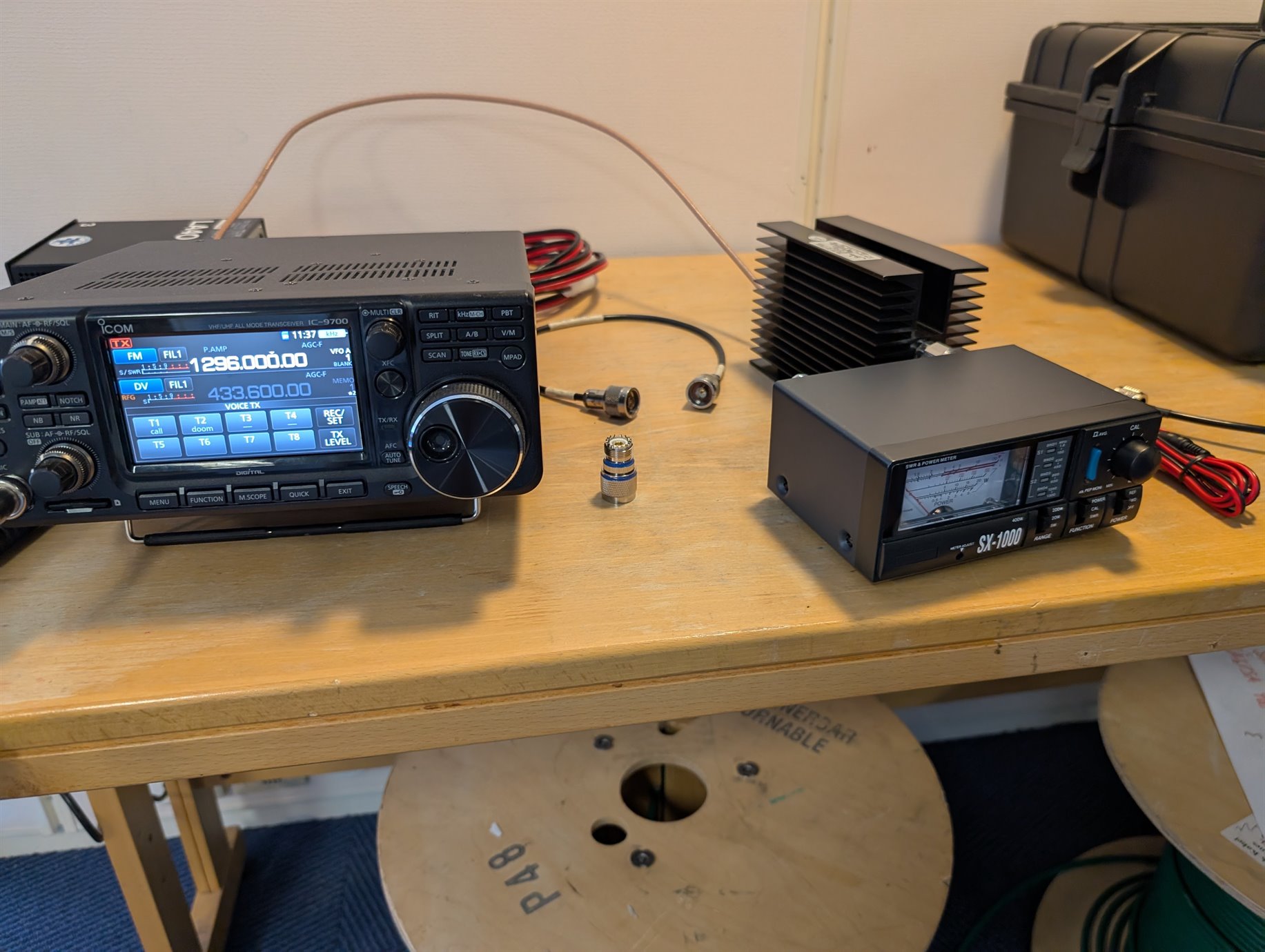 IC-9700, SX-1000 power meter and connectors staged indoors before the pass
